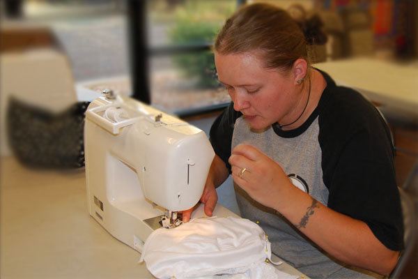 student shown sewing